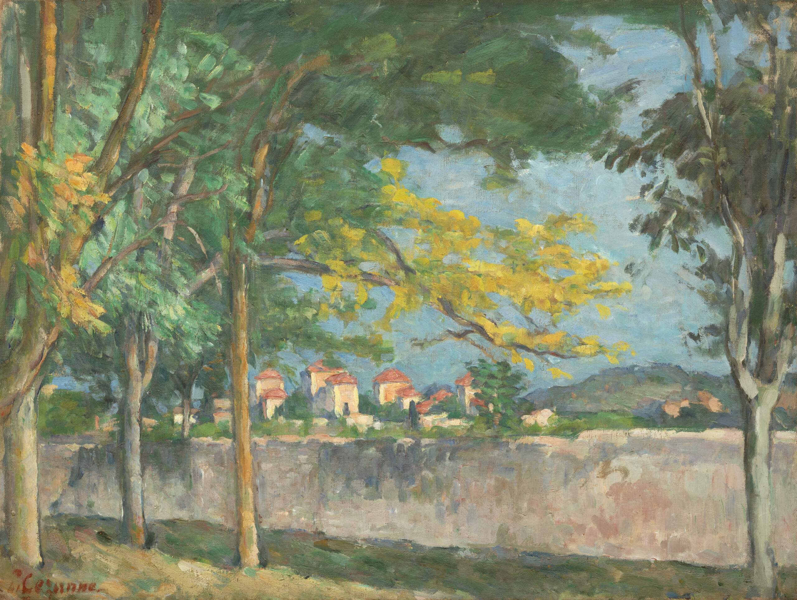 Impressionist painting by Paul Cézanne depicting trees, a large town wall, and houses in the distance